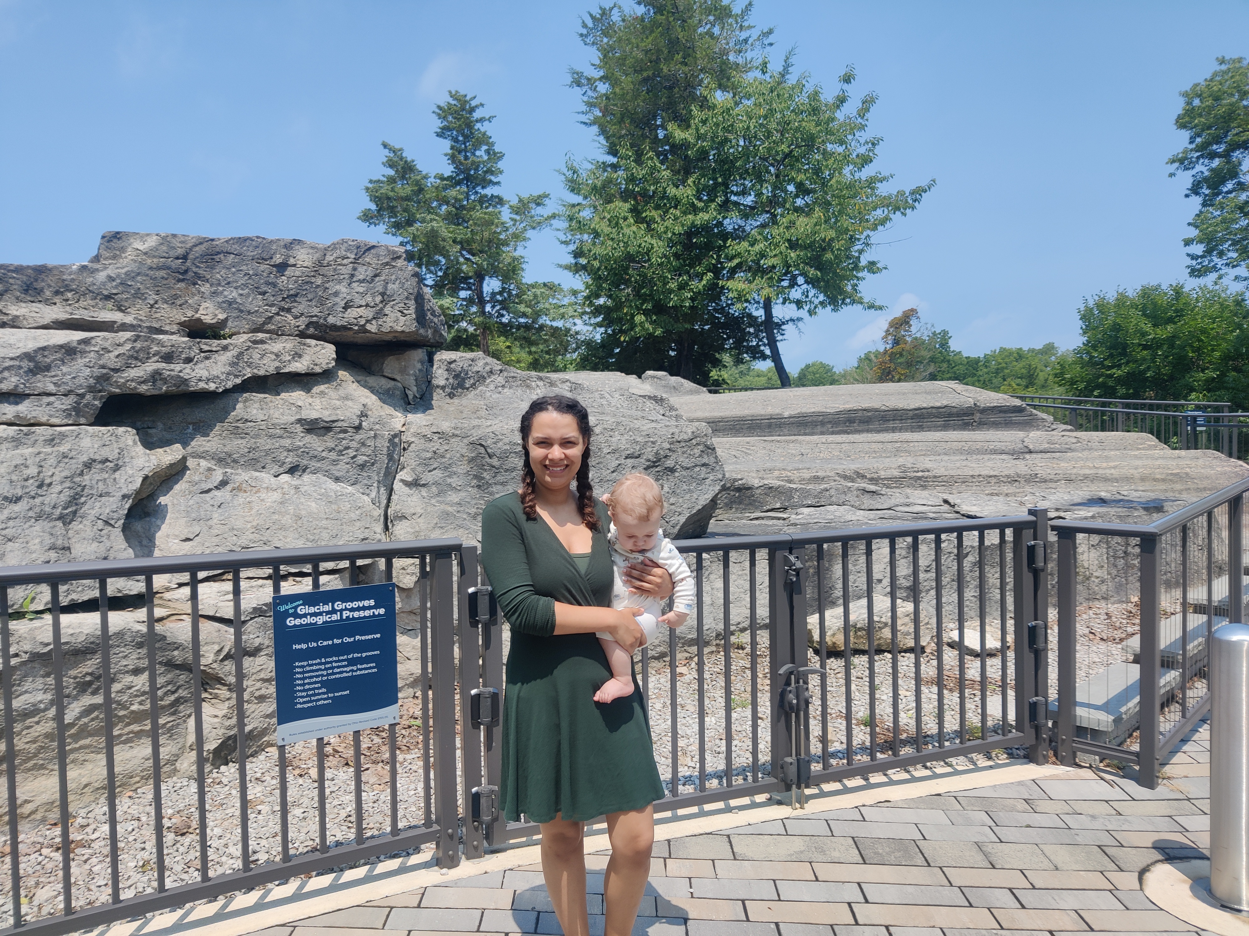 Aubri and Calvin standing in front of the Glacial Grooves.